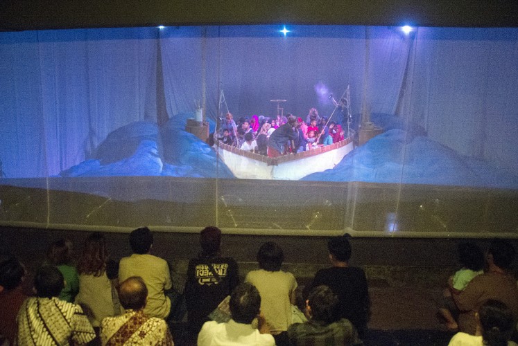 Playing around: A thin curtain separates the audience and children inside during Papermoon’s Child’s Story show.