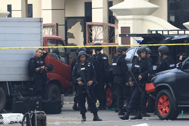 Police personnel guard the Mobile Brigade (Brimob) detention center in Depok, West Java, on May 10. A 30-hour prisoner riot and standoff happened from Tuesday evening until Thursday morning at the facility.