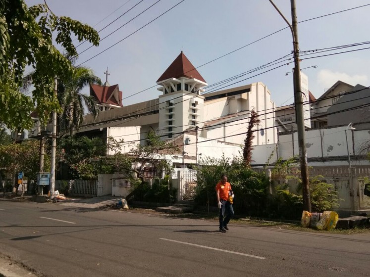 One victim was identified as a member of congregation of the Santa Maria Tak Bercela church on Jl. Ngagel Madya, while the other had yet to be identified.