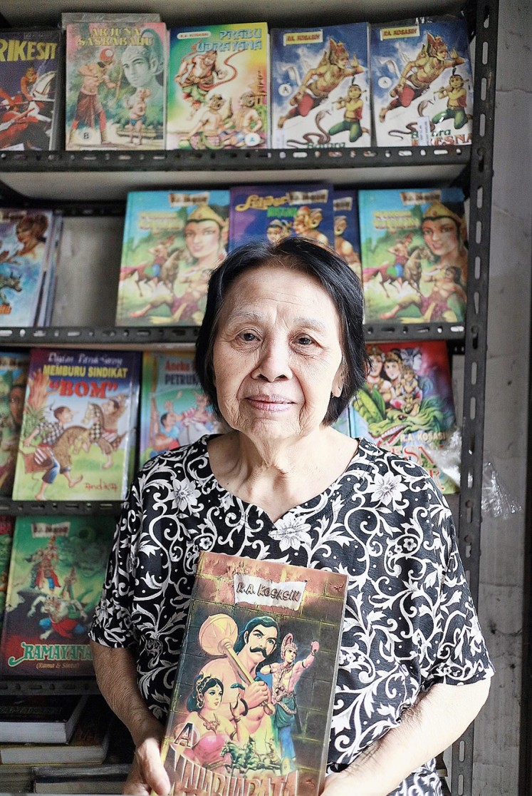 Sole guardian: Herlina Markus poses with a comic book in her Maranatha comic store in Bandung, West Java.
