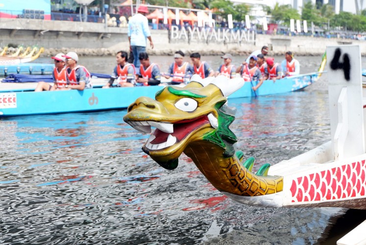 Symbol of power: A dragon head decorates the prow of a boat. 