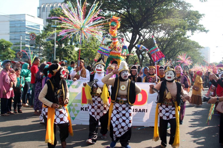 Semarang citizens wearing costumes participate in the Dugderan carnival held annually to celebrate the coming of Ramadhan.