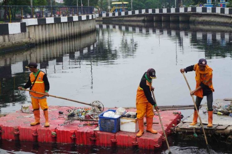 Public Facility Maintenance Agency personnel clean up the 