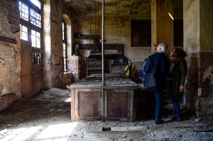 Architects visit the kitchen of the old Prinkipo Greek Orthodox orphanage at Princes island in Istanbul, on April 14, 2018.