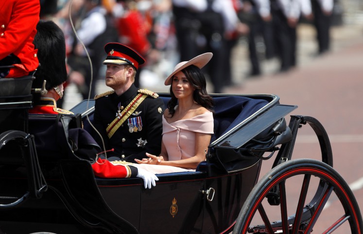Britain's Prince Harry and Meghan, Duchess of Sussex, take part in the Trooping of the Colour parade in central London, Britain, June 9