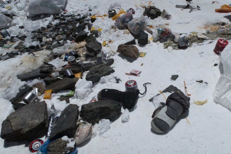 This handout picture taken on May 20, 2018 and released on June 12 by Damian Benegas shows discarded climbing equipment and rubbish scattered around Camp 4 of Mount Everest. Decades of commercial mountaineering have turned Mount Everest into the world's highest rubbish dump as an increasing number of big-spending climbers pay little attention to the ugly footprint they leave behind.