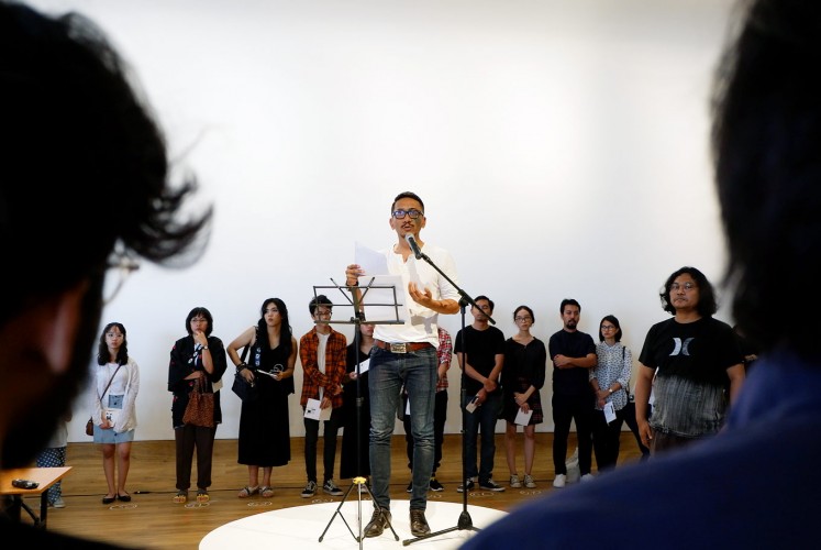 At play: Agung Kurniawan and 65 visitors perform a show dedicated to survivors of the 1965 tragedy at Museum MACAN in Jakarta.