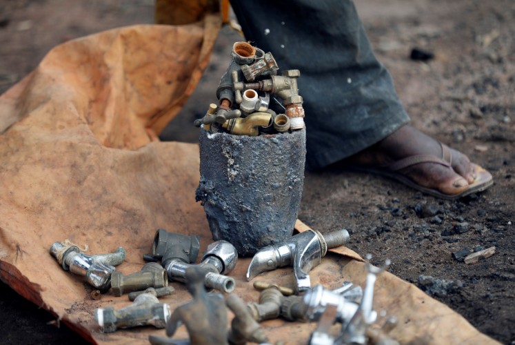 Tap heads are seen prepared as bronze materials at a melting site on Igun street in Benin City, Edo state, Nigeria June 13, 2018.