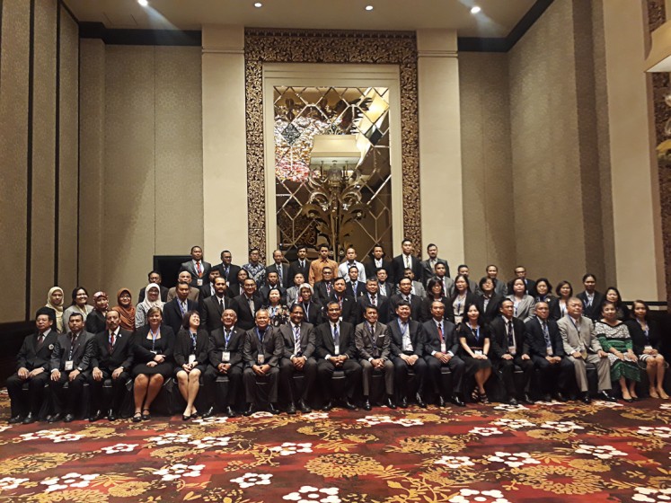 Participants of the first high-level regional meeting of the MEPSEAS Project take a picture after the opening ceremony of the event in Seminyak, Bali, on June 25.