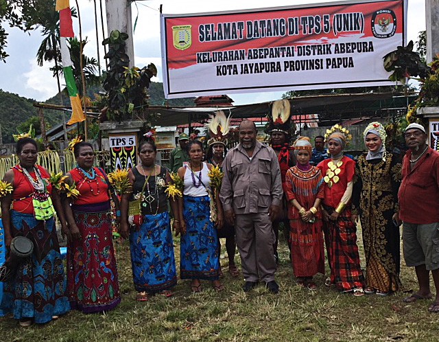 Diversity: Election officials in traditional dress from across the country pose for a group photo on June 27 at polling station TPS 005 in Awiyo subdistrict, Abepura district, Jayapura. 
