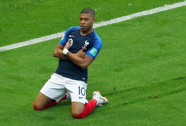 France's Kylian Mbappe celebrates after scoring their third goal while playing against Argentina in 2018 FIFA World Cup last 16 round soccer match at Kazan Arena in Kazan, Russia on Saturday. France won 4-3 to advance to quarterfinals.