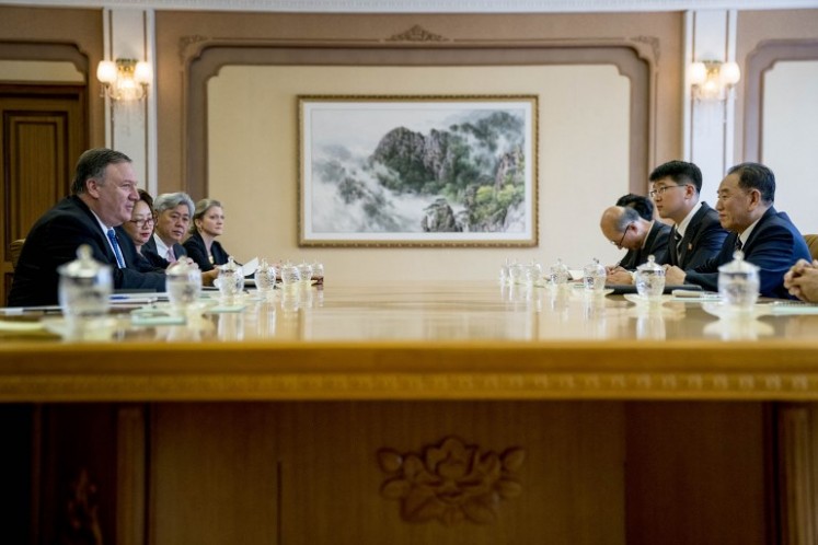 US Secretary of State Mike Pompeo (left) speaks during a meeting with North Korea's director of the United Front Department, Kim Yong Chol (right) at the Park Hwa Guest House in Pyongyang on July 6, 2018. Pompeo arrived in Pyongyang on July 6 to press Kim Jong Un for a more detailed commitment to denuclearisation following the North Korean leader's historic summit with President Donald Trump.