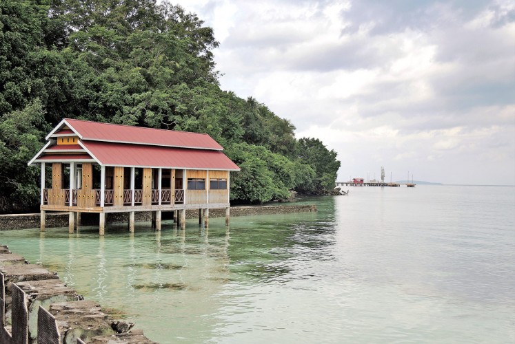 Dock on the bay: A lone house sits by one of Baubau's docks. 