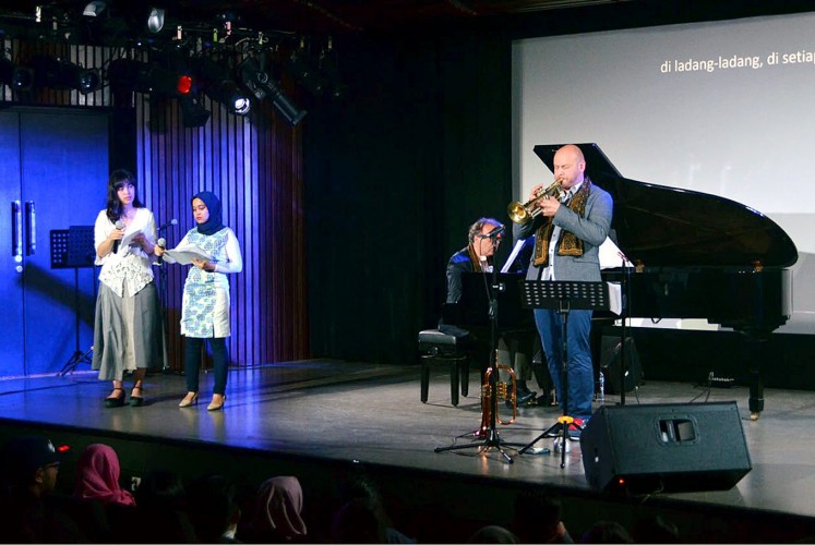 Message: Poem readers Amanda Ariawan and Meutia Delia (from left to right), pianist Alessandro Collina and trumpeter Marco Vezzoso perform Giannino Balbis' poem dedicated to the Nice attack. 