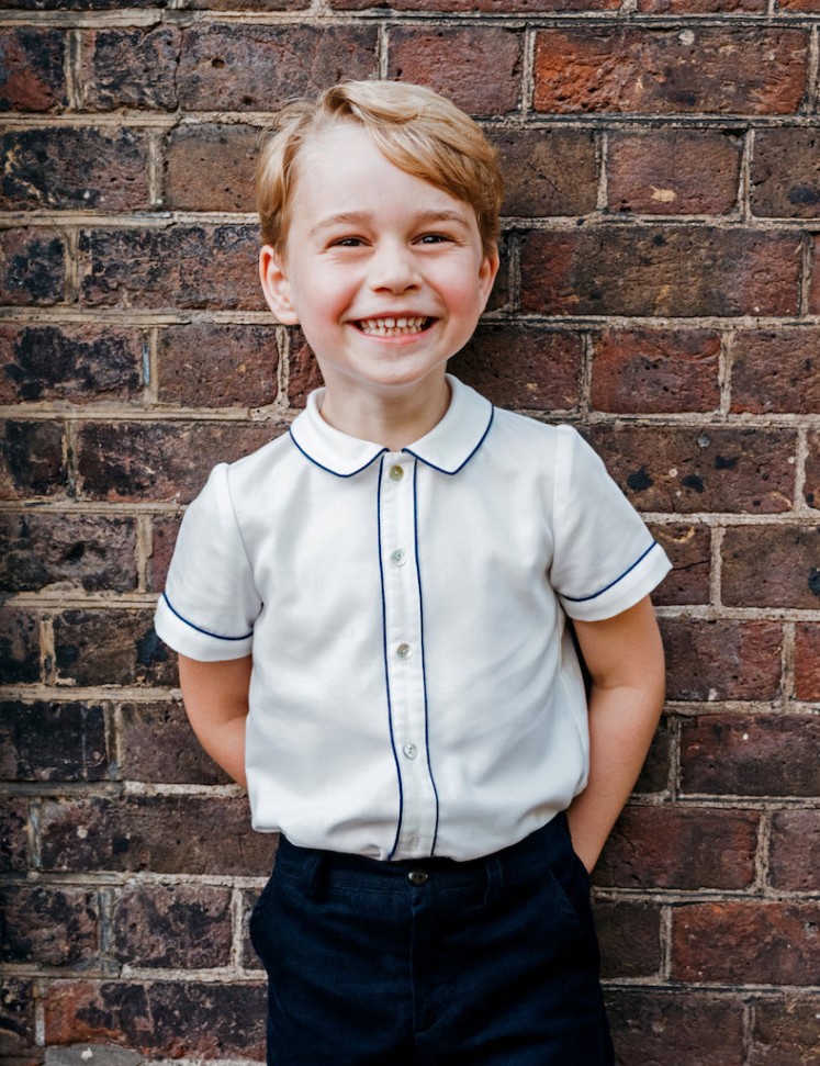Britain's Prince George, son of Prince William and Catherine, Duchess of Cambridge, poses for a photograph to mark his 5th birthday on Sunday 22nd July, in the garden at Clarence House in central London, Britain, July 9