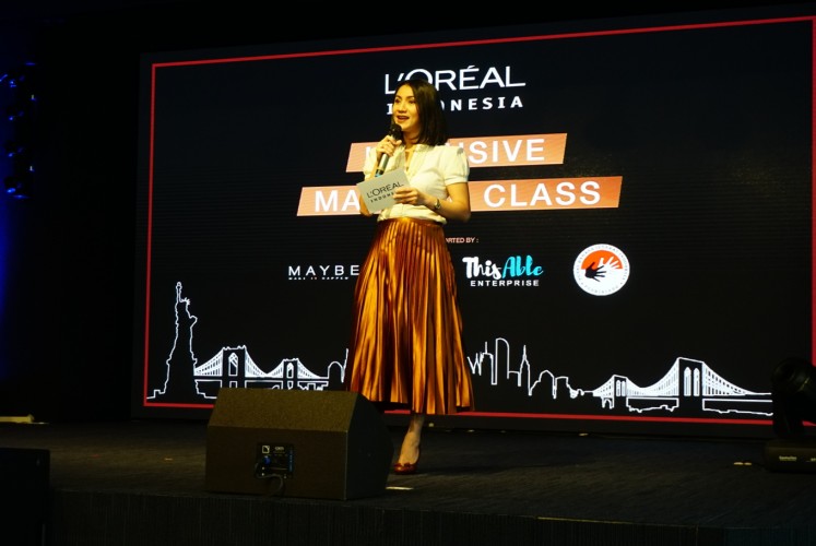 Melanie Masriel, L’Oreal Indonesia’s communications, public affairs and sustainability director, gives a speech before the event. 