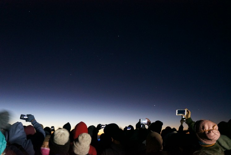 Under the starry sky: Tourists try to capture the beauty of sunrise at Penanjakan 1 at Bromo Tengger Semeru National Park (TNBTS).
