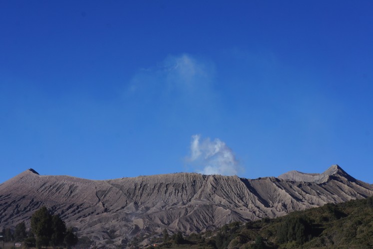 White ash coming out of the Mount Bromo's crater. 