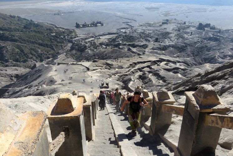 Tourists have to climb around 250 stairs to reach Mount Bromo's crater. 