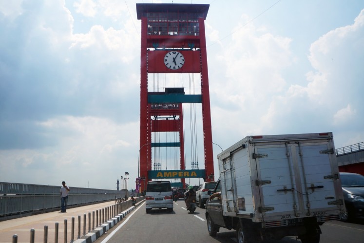 Ampera Bridge connects Palembang's Ulu and Ilir areas.