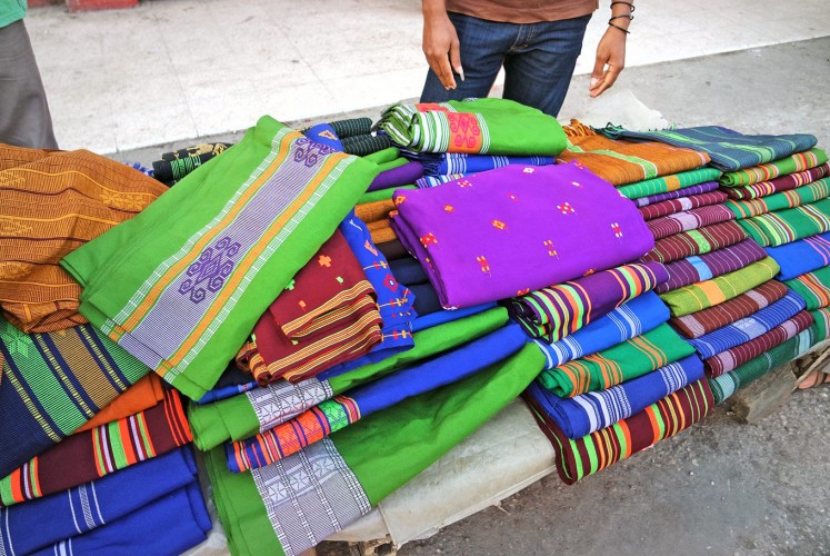 Up for grabs: Bolts of woven fabric are sold in a market in West Sumba, East Nusa Tenggara.