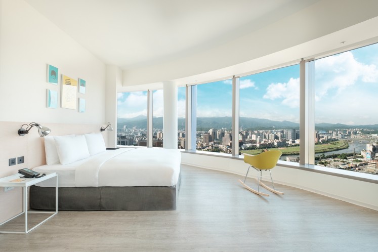 A loft king room with a view of a river at amba Songshan hotel.