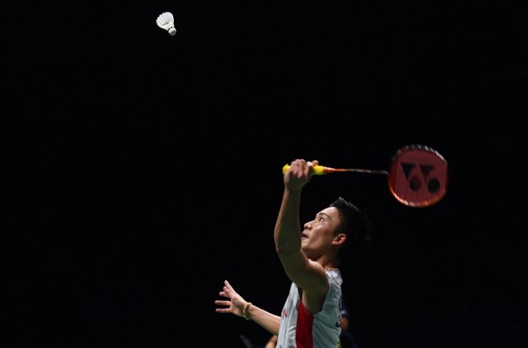Kento Momota of Japan hits a shot against Shi Yuqi of China in the men's singles final during the badminton World Championships in Nanjing, Jiangsu province on August 5, 2018. 
Johannes EISELE / AFP