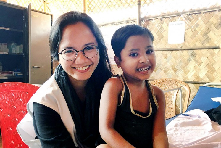 All smiles: Rangi Wirantika poses with a child during her assignment in Cox’s Bazar, Bangladesh.