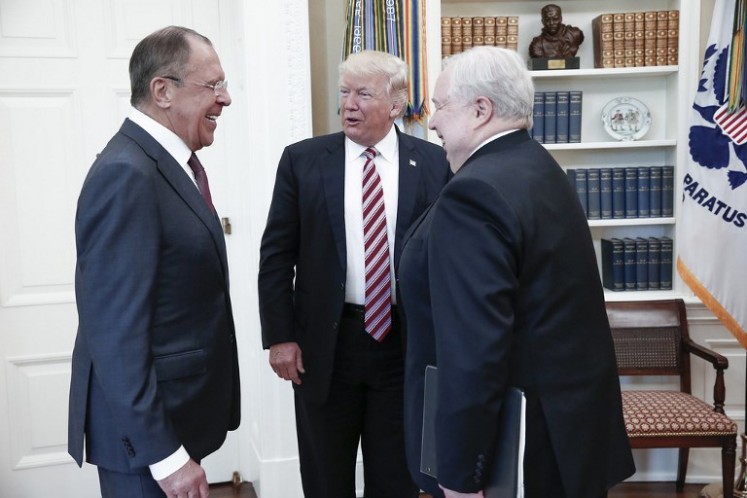 A handout photo made available by the Russian Foreign Ministry on May 10, 2017 shows US President Donald J. Trump (center) speaking with Russian Foreign Minister Sergei Lavrov (left) and Russian Ambassador to the U.S. Sergei Kislyak during a meeting at the White House in Washington, DC. US President Donald Trump on May 10 called on Russia to rein in Syrian President Bashar al-Assad and his key ally Iran, as Washington and Moscow sought to boost their fragile ties with high-profile White House talks. Russian Foreign Minister Sergei Lavrov, the highest-ranking Russian official to visit Washington since Trump came to power in January, earned a rare invitation to the Oval Office for a head-to-head with the Republican president.