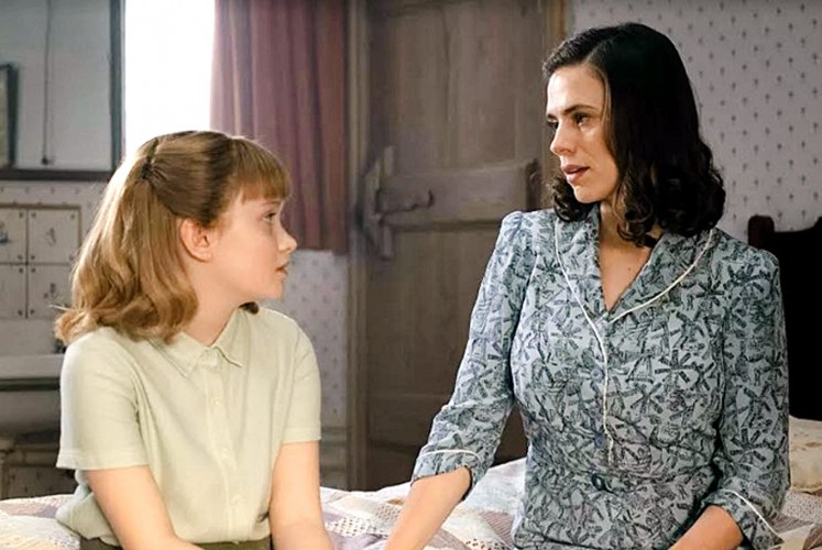 Family ties: Madeline (Bronte Carmichael, left) and Evelyn (Hayley Atwell) are Christopher Robin's wife and daughter.