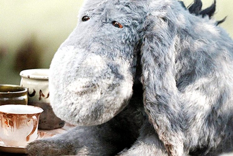 Sad, as always: Eeyore (voiced by Brad Garrett) is a depressed donkey who delivers Christopher Robin's best jokes.
