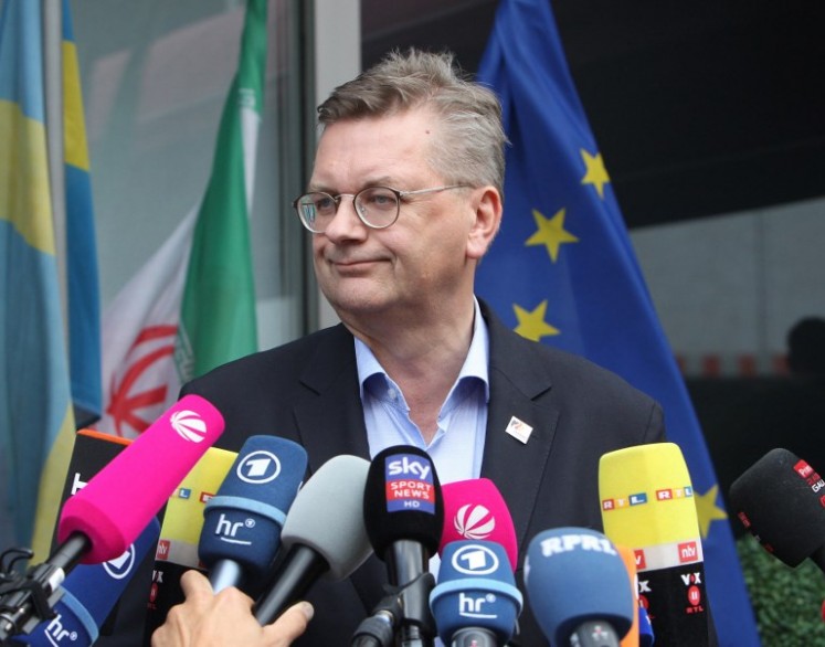 President of the German Football Association (DFB) Reinhard Grindel talks to media as he arrives at Frankfurt international airport on June 28, 2018, after flying back from Moscow following the German national football team's defeat in the Russia 2018 football World Cup. Germany's embattled national team braced for a cold homecoming on June 28, 2018 after a shock World Cup exit that has plunged the football-mad nation into mourning and leaves the future of coach Joachim Loew in the balance.