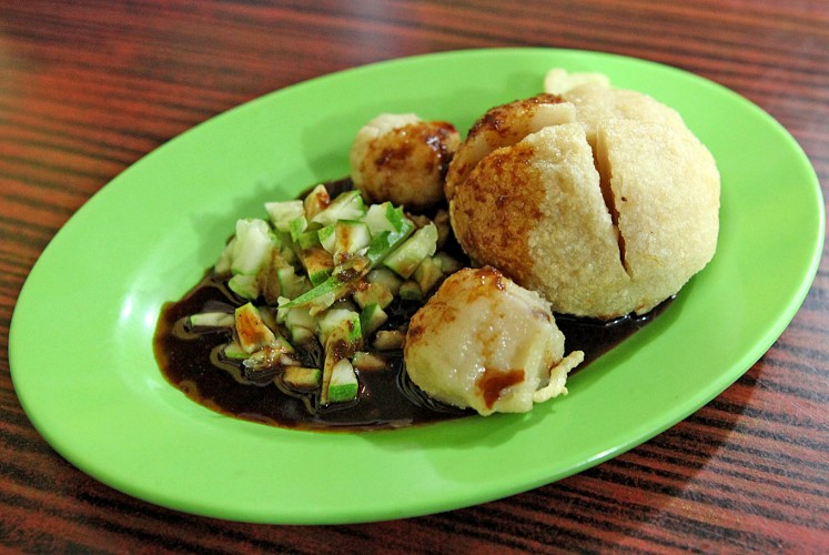 Take a bite: Never leave Palembang without tasting the city's best-known traditional dish, pempek (fishcake with vinegar and soy sauce).