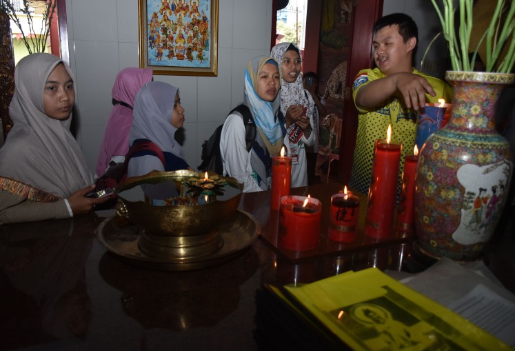 Peace Train participants visit the Kwan Im Tong temple in Batu, East Java.