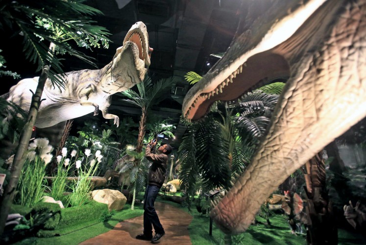 Prehistoric: A visitor takes a picture inside the Jurassic Research Center. Prehistoric: A visitor takes a picture inside the Jurassic Research Center.