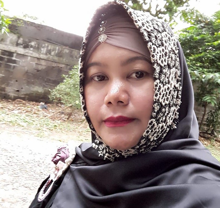 Forty-year-old Nur Komariah, known to her clients as Ibu Ria, has been a pawang hujan for over two decades. 