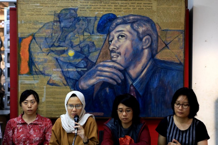 Yunita from LBH Jakarta, Kontras Coordinator Yanti Andriani, Munir's widow Suciwati and Puri Kencana from Amnesty International speak during a press conference in Jakarta on Sept. 7. Human rights activists have urged the government to solve the murder of activist Munir Said Thalib 14 years ago.