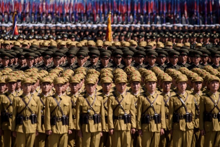 Korean People's Army (KPA) soldiers take part in a mass rally on Kim Il Sung square in Pyongyang on September 9, 2018. Thousands of North Korean troops followed by artillery and tanks paraded through Pyongyang on September 9 as the nuclear-armed country celebrated its 70th birthday, but it refrained from displaying the intercontinental ballistic missiles that have seen it hit with sanctions.