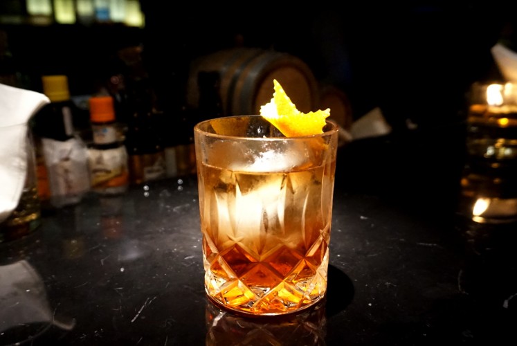 Goldstein's smoky autumn leaves, consisting of whiskey, Calvados, sweet Vermouth, Strega and Angostura bitters.  
