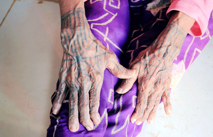 Where it begins: The back of the hands of Siboirot Tubu Sakeru were the first to be tattooed, followed by parts of her body. 