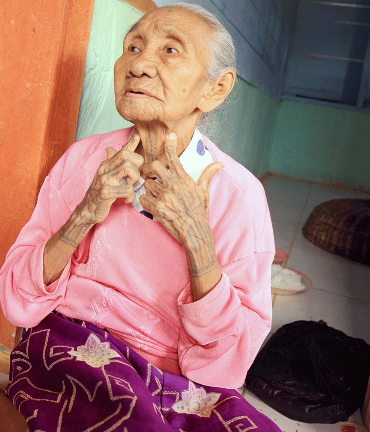 Survivor: Siboirot Tubu Sakeru, 87, a resident of Kinumbu hamlet in Bulasat village, is the only one of more than 9,000 Mentawai people living on the island of South Pagai who still bears traditional tattoos. 