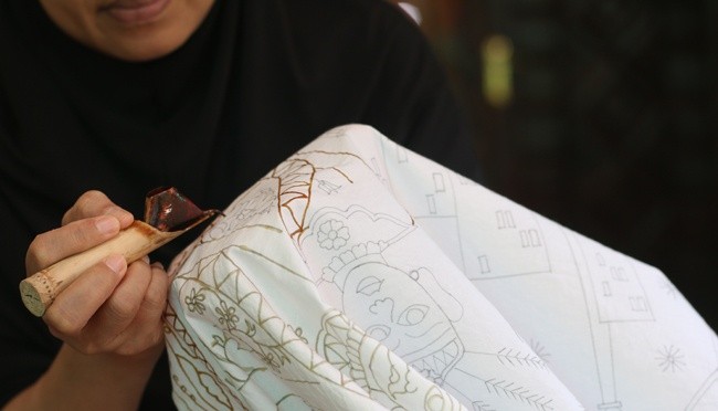 Betawi batik textile with an 'ondel-ondel' (Betawi effigies) motif.