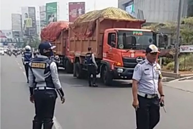 Bekasi Transportation Agency officers halt some Jakarta dump trucks on their way to Bantar Gebang waste treatment facility in Bekasi, West Java, on Oct. 17, 2017. 