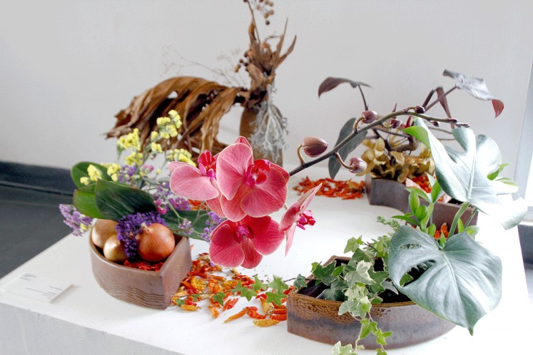 Transitions: Chime Nakajima has used four “pies” of a ceramic vessel for a seasonal arrangement in Four Seasons.