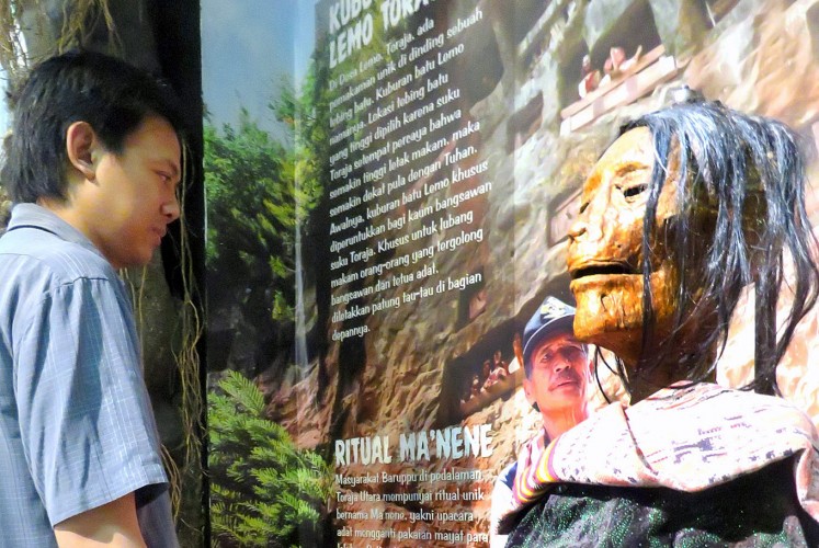 Remembering loved ones: Museum curator Delta Bayu Murti observes a mummy replica generally found at Ma’nene, a tradition to remember ancestors, in North Toraja, South Sulawesi.