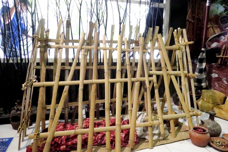 Final destination: A replica of Bali’s Trunyan cemetery features genuine human skeletons housed inside a triangular bamboo cage.