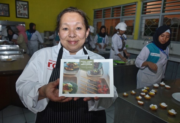 Chef Pipiet Fardiman from Amsterdam's MBO College Centrum ROC shows a food catalog she created. 