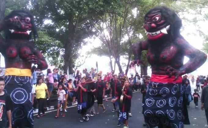 People wear 'genderuwo' ghost costumes during a cultural parade near Mount Merapi in Central Java. 