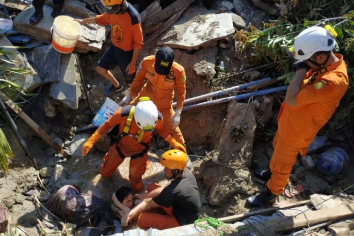 Search and rescue personnel work hard to free Nurul in Balaroa, Palu, on Sept. 29, after a powerful earthquake struck the city.
