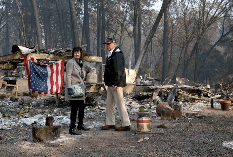 Charred community: United States President Donald Trump (right) visits the Skyway Villa Mobile Home and RV Park, a neighborhood destroyed by fire with Mayor Jody Jones in Paradise, California, on Saturday. 